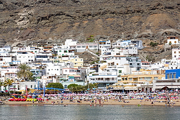 People enjoying the beach at Puerto de Mogan, Gran Canaria, Canary Islands, Spain, Atlantic, Europe