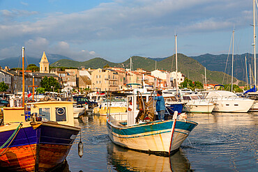 Traditional fishing boat moored in the small harbour of Saint Florent in northern Corsica, France, Mediterranean, Europe