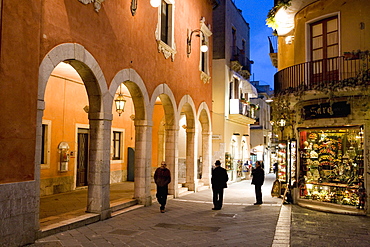 Locals in street at night, Taormina, Sicily, Italy, Europe