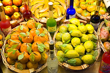 Window display of traditional marzipan fruits and grappa, Taormina, Sicily, Italy, Europe