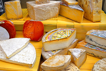 Assorted French cheeses on a market stall, La Flotte, Ile de Re, Charente-Maritime, France, Europe