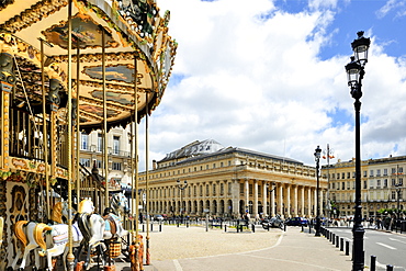 Merry go round on Allees de Tourny looking towards the National Opera House (Opera National De Bordeaux), Bordeaux, UNESCO World Heritage Site, Gironde, Aquitaine, France, Europe