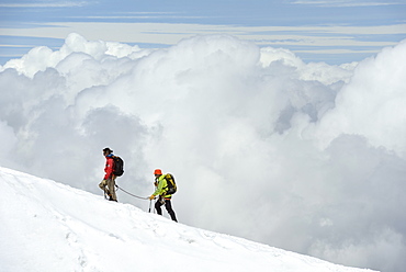 Mountaineers, climbers high up in the clouds, Aiguille du Midi, Mont Blanc Massif, Chamonix, Haute Savoie, French Alps, France, Europe