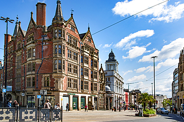 The building on the left is Parade Chambers, built between 1883-1855, as stationers and printers offices and the building on the right is the former headquarters of the Sheffield Telegraph and Star, built between 1913-16, High Street, Cathedral Quarter,