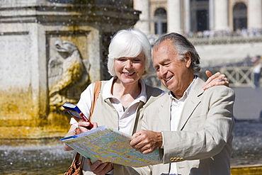 Senior tourists sightseeing in St. Peters Square, Rome, Italy, Europe