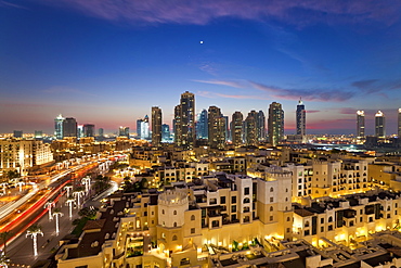 The Palace Hotel in the grounds of the Burj Khalifa park viewed towards the high rises of Dubai Marina area, Dubai, United Arab Emirates, Middle East