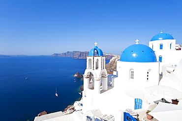 Blue domed churches in the village of Oia, Santorini (Thira), Cyclades Islands, Aegean Sea, Greek Islands, Greece, Europe