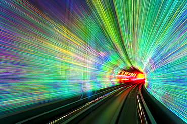 Blurred motion light trails in a train tunnel under the Huangpu River linking the Bund to Pudong, Shanghai, China, Asia