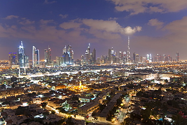 Elevated view of the new Dubai skyline of modern architecture and skyscrapers including the Burj Khalifa on Sheikh Zayed Road, Dubai, United Arab Emirates, Middle East