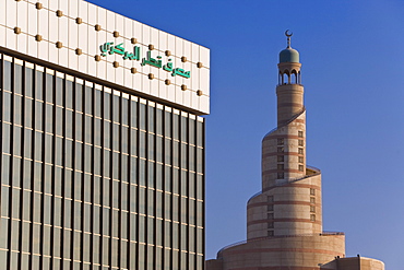 Qatar Central Bank and the spiral mosque of the Kassem Darwish Fakhroo Islamic Centre in Doha based on the Great Mosque in Samarra in Iraq, Doha, Qatar, Middle East