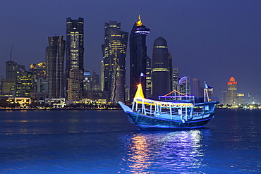 New skyline of the West Bay central financial district of Doha, illuminated at dusk, Qatar, Middle East