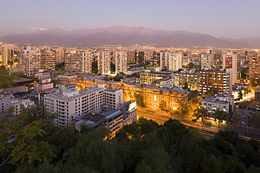 City skyline and the Andes mountains at dusk, Santiago, Chile, South America