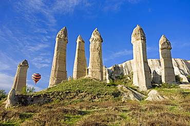 Hot air balloon over the phallic pillars known as fairy chimneys in the valley known as Love Valley near Goreme in Cappadocia, Anatolia, Turkey, Asia Minor, Eurasia