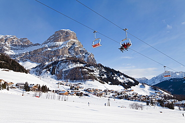 The village of Colfosco in Badia, 1645m, and Sella Massif range of mountains under winter snow, Dolomites, South Tirol, Trentino-Alto Adige, Italy, Europe