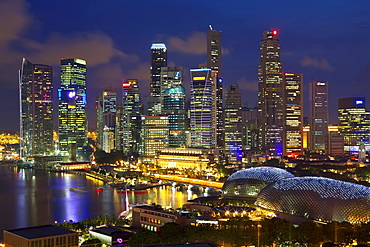 Skyline of Financial district illuminated at dusk, Singapore, Southeast Asia, Asia