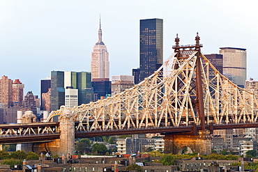 Queensboro Bridge, Manhattan skyline and the Empire State Building viewed from Queens at dawn, New York, United States of America, North America