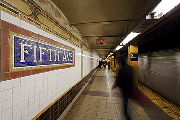 Subway station and train in motion, Manhattan, New York City, New York, United States of America, North America
