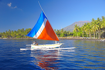 Local fisherman on a traditional outrigger boat, Bali, Indonesia, Southeast Asia, Asia