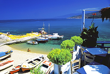 Restaurant overlooking fisherman's bay, Ikaria, Greece, Europe