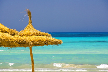 Parasols on beach, Rethymno, Crete, Greek Islands, Greece, Europe