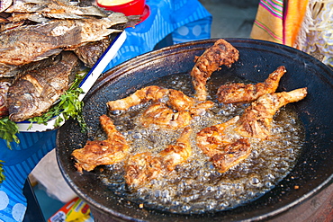 Pollo Campero (fried chicken) in the market at Santiago Sacatepequez, Guatemala, Central America