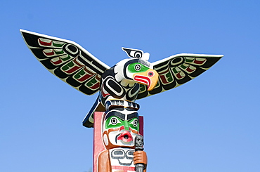 Totem poles in cemetery in Alert Bay, British Columbia, Canada, North America 