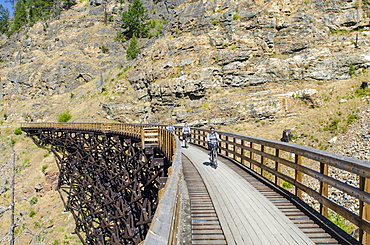 Biking the old railway trestles in the Myra Canyon, Kelowna, British Columbia, Canada, North America