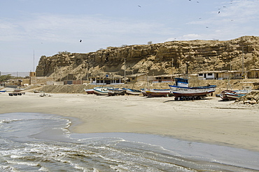 Fishing boats on beach Los Organos village near Mancora, Peru, South America