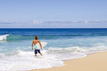 Surfing at Sunset Beach, North Shore, Oahu, Hawaii, United States of America, Pacific