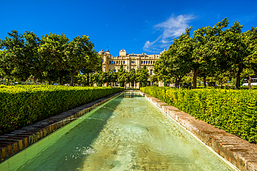 Fountain in Pedro Luis Alonso Gardens (Jardines de Pedro Luis Alonso) and the Ayuntamiento de Malaga (Malaga City Hall), Malaga, Costa del Sol, Andalusia, Spain, Europe