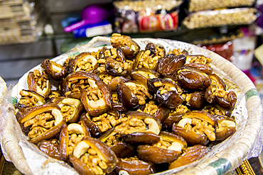 Dates stuffed with nuts in the shops along narrow cobblestone streets of Kasbah in Bab Al Fahs, old Medina, Tangier, Morocco, North Africa, Africa