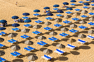 Beachgoers and umbrellas at Praia dos Pescadores or Fishermans Beach, Albufeira, faro district, algarve, portugal, europe.