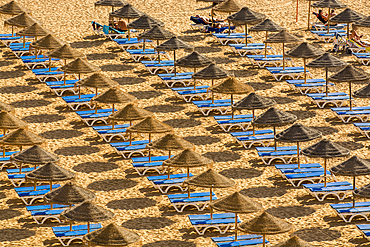 Beachgoers and umbrellas at Praia dos Pescadores or Fishermans Beach, Albufeira, faro district, algarve, portugal, europe.