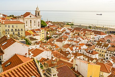 Skyline of Alfama district overlooking the Tagus River, Alfama district, Lisbon, Portugal.