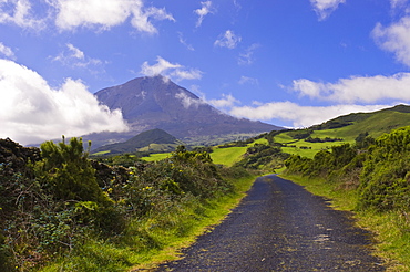 Country road with Mount Pico volcano in background, Pico, Azores, Portugal, Europe