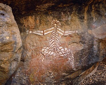 Aboriginal rock painting on red and black rock face, Kakadu National Park, Northern Territory, Australia