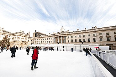 England, London, Skating on the seasonal ice rink at Somerset House.