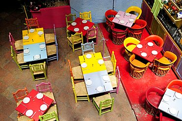 Mexico, Bajio, Queretaro, Elevated view looking down on tables in colourful restaurant interior.