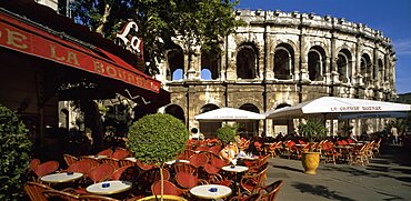 FRANCE Gard Nimes.  Cafe with outside tables in front of the Arenes.