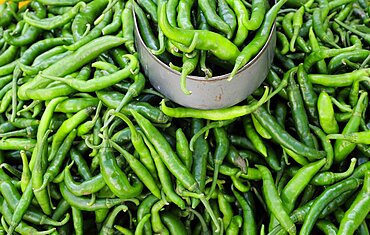 Mexico, Veracruz, Papantla, Green chillies for sale in the market.