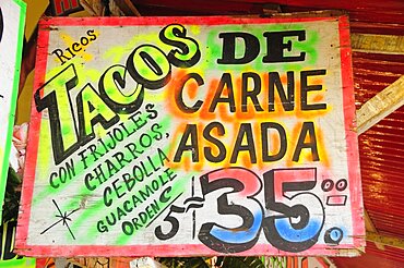 Mexico, Bajio, Zacatecas, Sign for taco food stall with highlighted text and price.