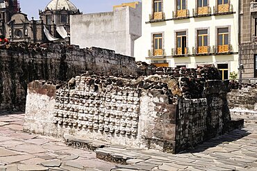 Mexico, Federal District, Mexico City, Wall of Skulls or tzompantli in the Templo Mayor Aztec temple ruins.