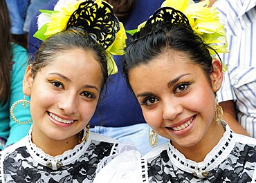 Mexico, Jalisco, Guadalajara, Portrait of two young women Jalisco folkloric dancers.