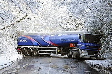 Weather, Winter, Snow, Jack-knifed fuel tanker on icy A22 main road near Nutley East Sussex after heavy snowfall. Truck has spun and is facing in the opposite direction to the one it was travelling in.