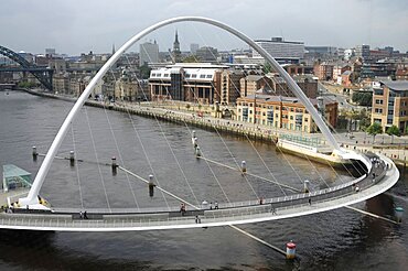 England, Tyneside, Gateshead, Millennium Bridge in closed position from the Baltic Arts Centre looking towards Newcastle Quayside and Newcastle upon Tyne city.