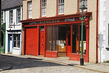 Ireland, County Tyrone, Omagh, Ulster American Folk Park 19th century street Blair stationers shopfront.