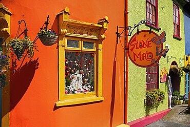 Ireland, County Cork, Kinsale, Colourful facades in market place with flower pots.