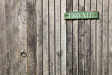 England, West Sussex, Chichester, Architecture Doors Detail of wooden gate and fence with priavte sign.