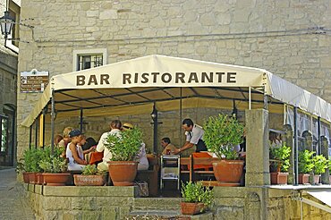 Republic of San Marino, San Marino City, Tourists sat in outdoor restaurant.