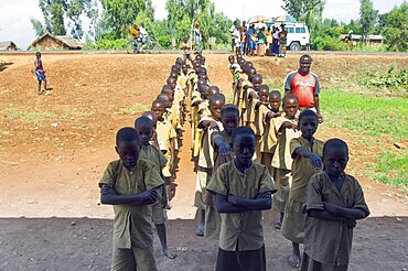 Burundi, Cibitoke Province, Buganda, Ruhagurika Primary Students lining up ready to go into their Catch-Up Class. Catch up classes were established by Concern Worldwide across a number of schools in Cibitoke to provide a second chance for children who had previously dropped out of school.